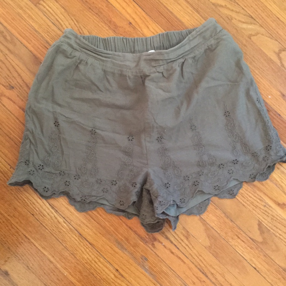 High waisted, olive green shorts.